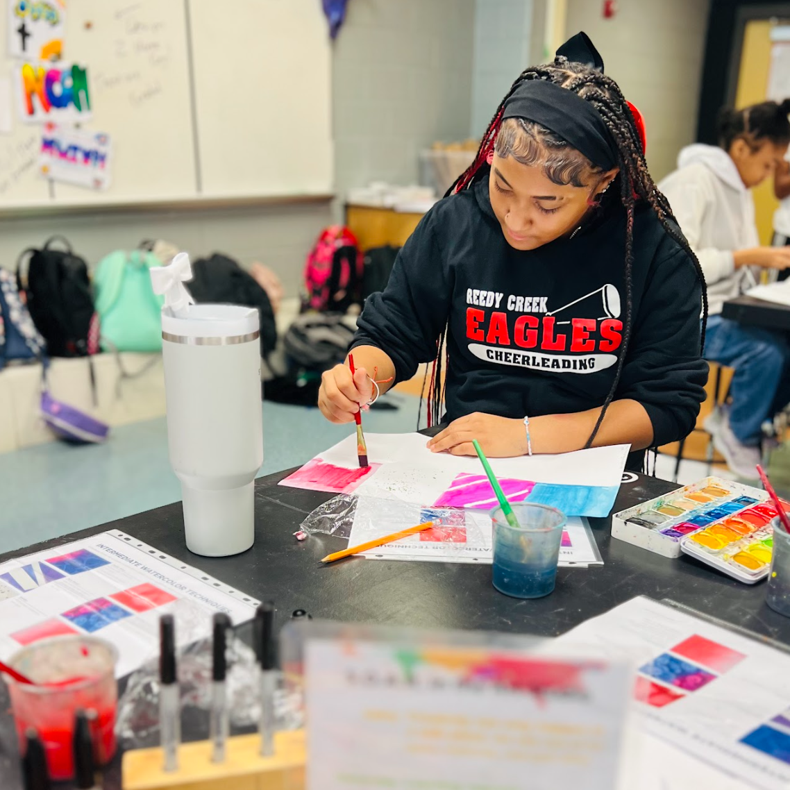  Student learning how to work with watercolors in Painting class